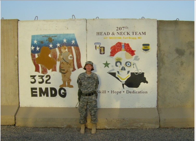 image of soldier in ACU's standing in front of unit symbol as an author photo for post
